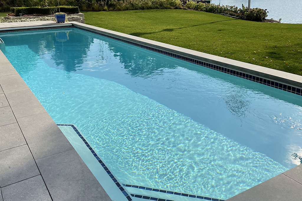 luxurious custom concrete pool design by signature pools.