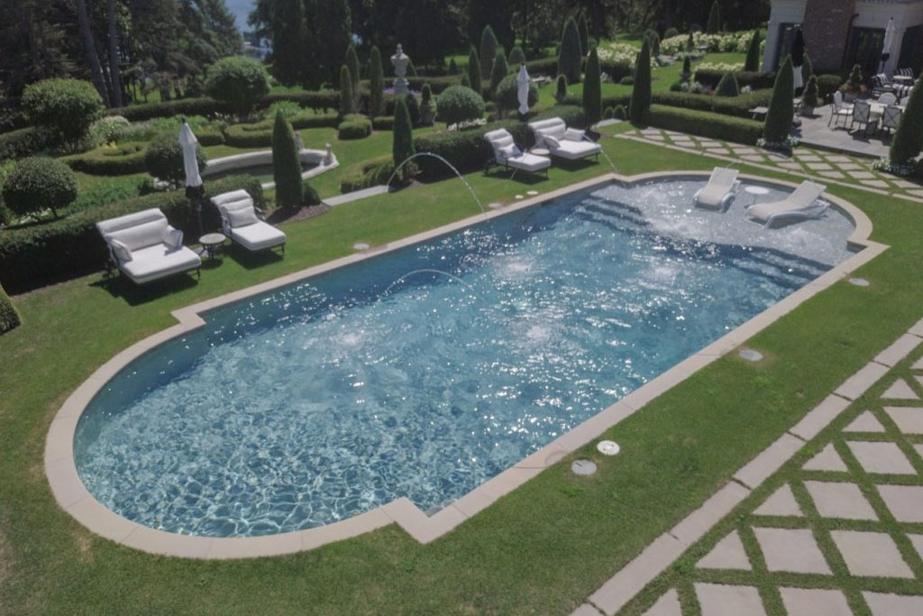 Timeless Elegance custom pool design with fountains by Signature Pools