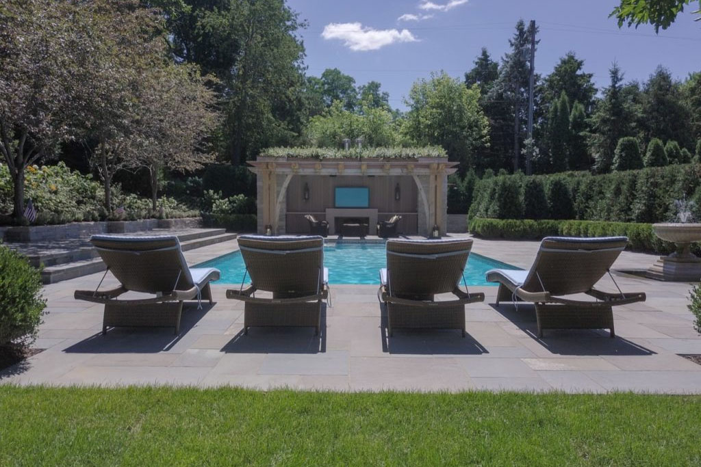 Private Escape custom pool design with lounge chairs by Signature Pools